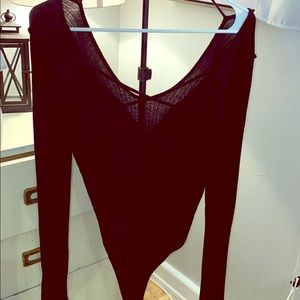 Low cut, long-sleeve black body suit